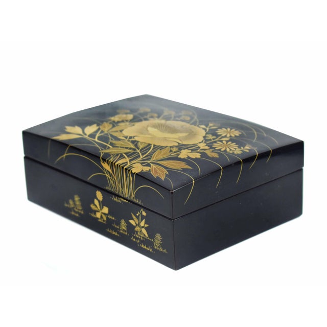 This mid-20th-century Japanese lidded box is a masterclass in the refined lacquerware artistry of the renowned Heian...