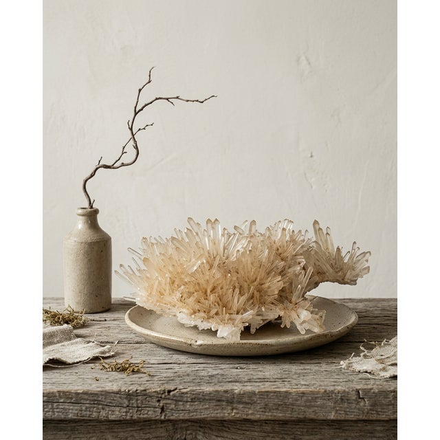 A sculptural natural Golden Healer quartz specimen selected for its horizontal island-like formation, warm champagne-gold...