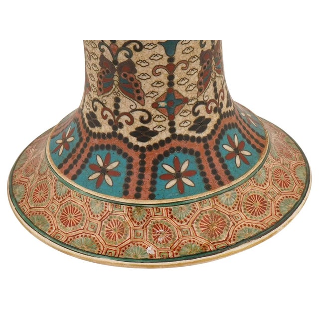 A large and exceptionally detailed Japanese cloisonné enamel and Satsuma ceramic vase dating to the Meiji period, circa...
