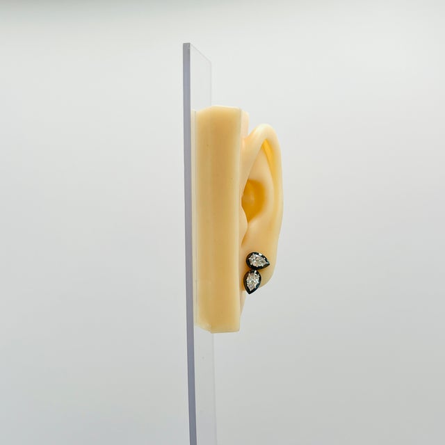 Gorgeous 2.01 ct. I SI white diamond pear shapes. Handmade in 18k yellow gold and black rhodium. Push back setting. Stones...