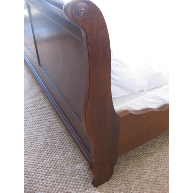 This solid wood Sleigh Bed has integrated curves with medallion design at the ends of the headboard and footboard. The...