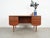 The desk was made in the 1960s, designed by Danish design icon J. Svenstrup. The structure and top are covered with teak...