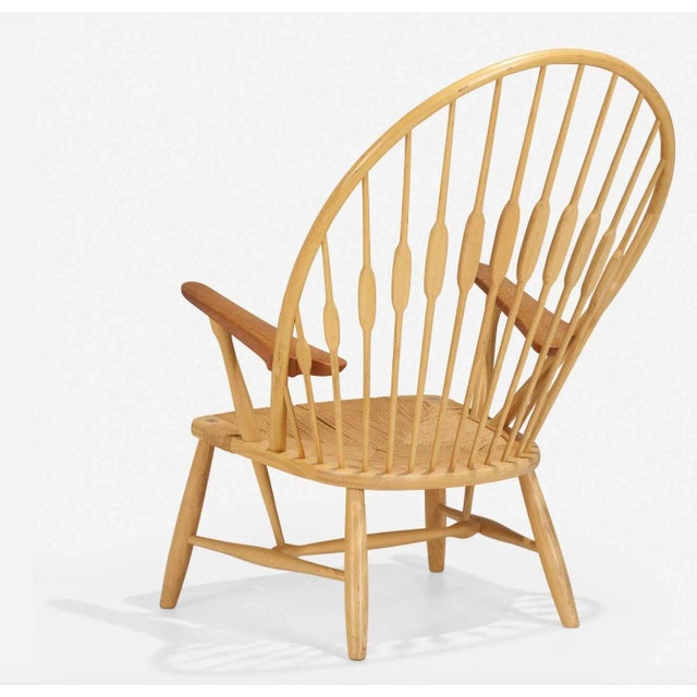 Hans J. Wegner for Johannes Hansen Peacock Chair made in Denmark, 1947 Ash frame with Teak arms and grass cord seatBranded...