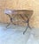 Directoire style writing desk with oak top iron base with brass accents. A gorgeous piece!