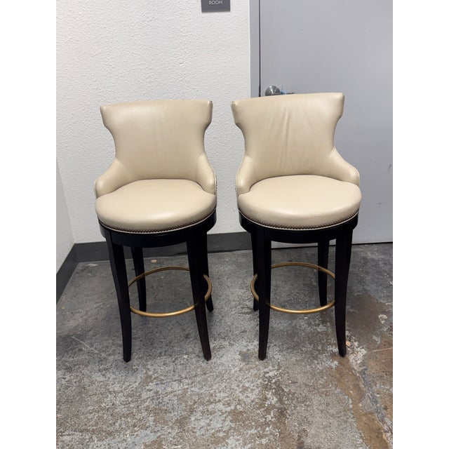 Design Plus Gallery presents a pair of Tracy Swivel Barstools by Century Furniture. This elevated seating design is...