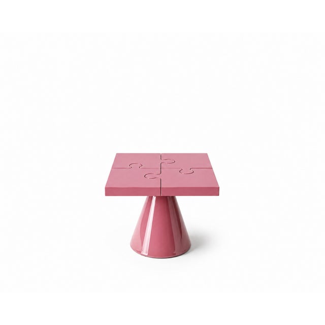 Popzlle turns a side table into a small piece of wit: its square top is cut into four interlocking puzzle pieces, finished...