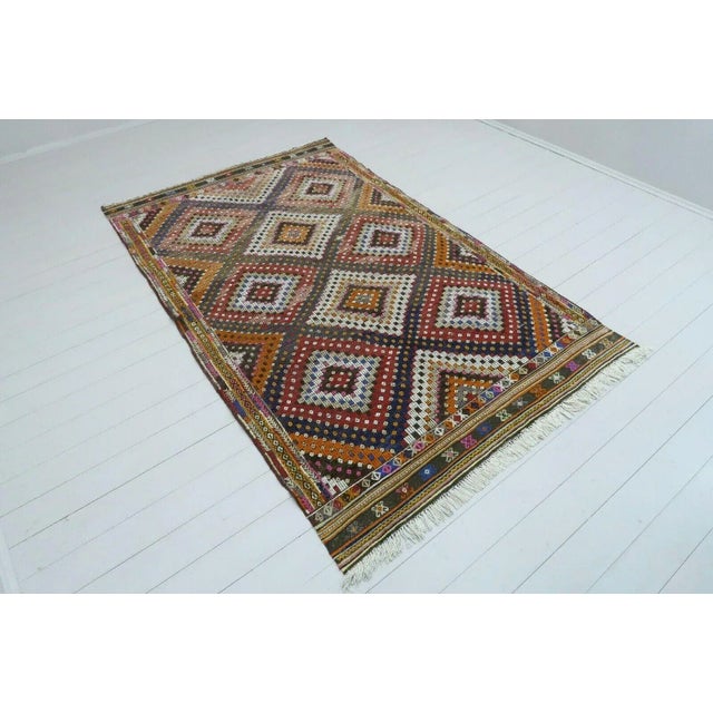 This beautiful, vintage, handwoven kilim is approximately 60 years old. It is handmade, of very fine quality hand spun...