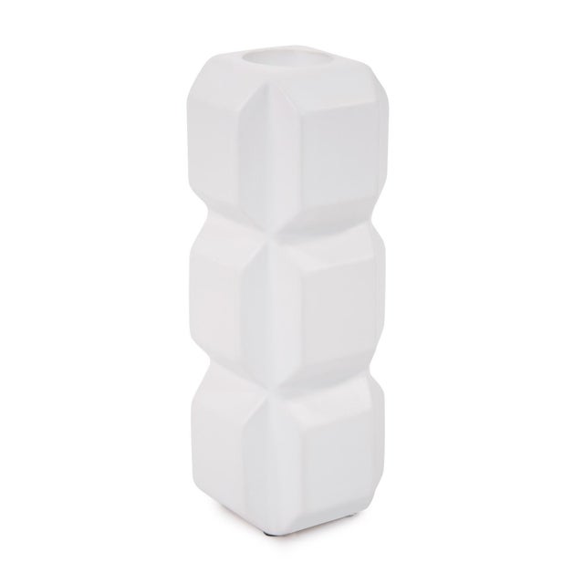 The simplicity of the cube is studied and refined in the cubic candle holders. Angled edges gave each section of stacked...