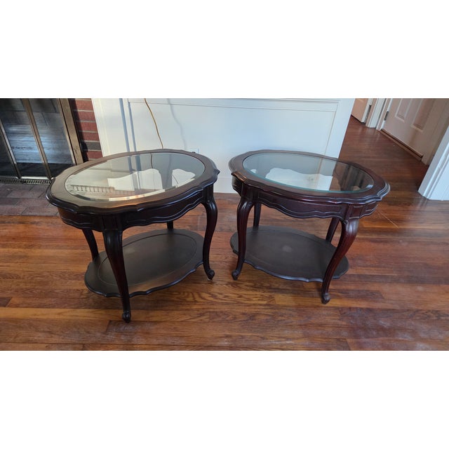 Vintage Mahogany and glass end tables. Two available.