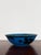 Large centerpiece bowl or decorative plate in stoneware, glazed in blue with stylised black designs, produced and designed...