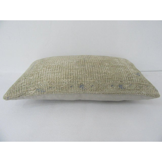 Decorative pillow cover made from a vintage Turkish handknotted rug. Backed with good quality cotton fabric. Pillow...