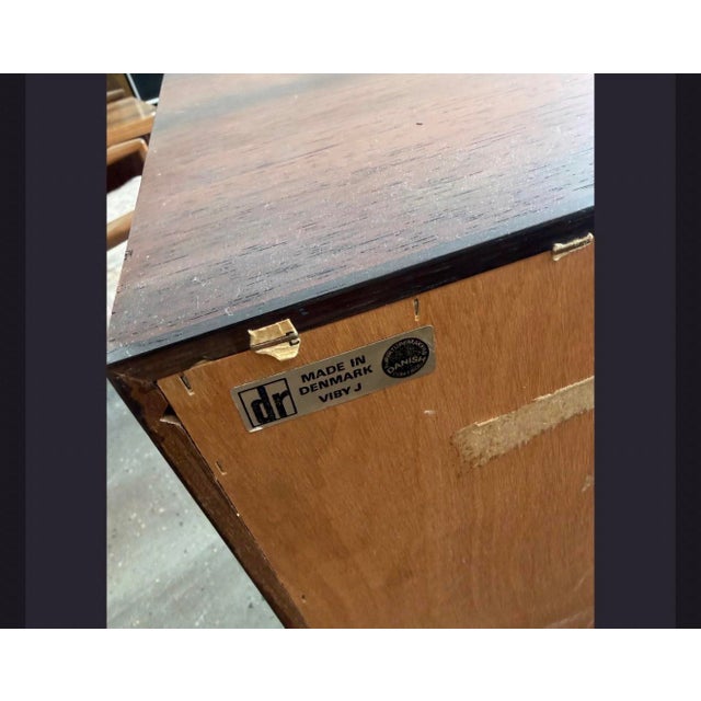 Crafted in Denmark by Dammand & Rasmussen, this elegant rosewood sideboard exemplifies the refined simplicity of...