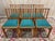 Set of six solid wood chairs, meticulously crafted with clean lines, typical of the second half of the 20th century. The...