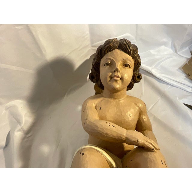 This Angel has sat on our bookshelf for many years and my parent’s bookshelf before that. I inherited her when they passed...