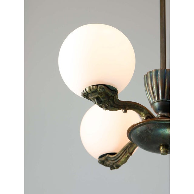 Beautiful figural details on each arm. takes 3x e27 light bulb (not included). A standard e26 american/canadian size also...