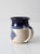 This is a vintage studio pottery mug by Alaskan artist, Jeanne Stolberg. The handmade mug has a beautiful blue and cream...