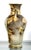 This 1920's Japanese Moriage Vase is a true collector's item. With a light brown and gold color scheme, the vase features...