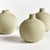 With a matte glaze, imperfect texture and basic form, these three soft green bud vases are simple and raw. Just like a...