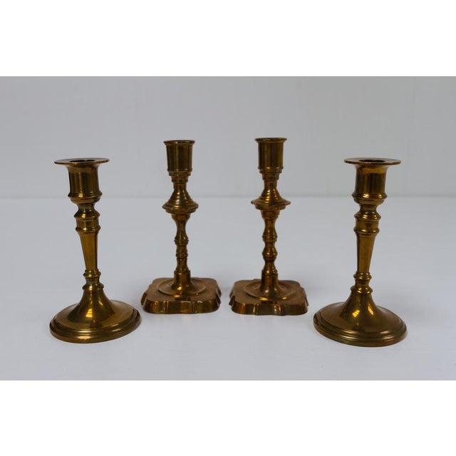 Vintage Danish Malm Candle Holders, 1950s. Set of 4. Two pairs of candleholders in malm, which is a brass alloy with added...