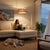 The Stretch Arc Lamp is a modern design by Kirby Groce, featuring a striking architectural silhouette that serves as a...