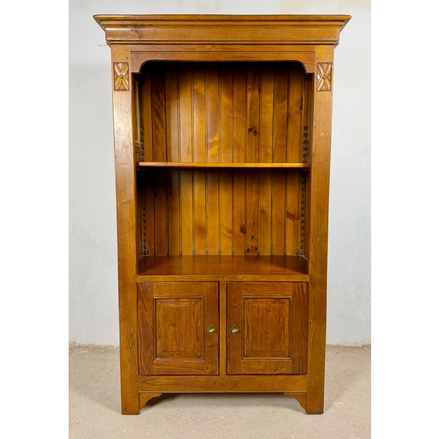 Spanish bookcase cabinet dating from the mid-20th century. Crafted in wood, it features a tall open upper section with two...