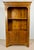 Spanish bookcase cabinet dating from the mid-20th century. Crafted in wood, it features a tall open upper section with two...
