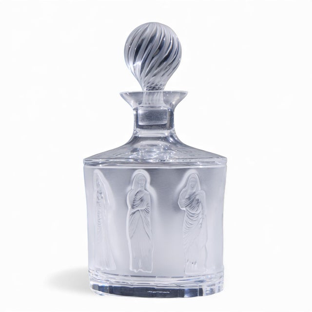 Lalique French Femmes Crystal Set of Decanter and Tumbler Glasses The decanter measures: 5.5 wide x 4.25 deep x 9.5 inches...