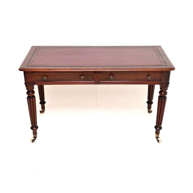 A superb antique Victorian writing table / desk. This was made in England, it dates from around the 1850-1870 period. This...