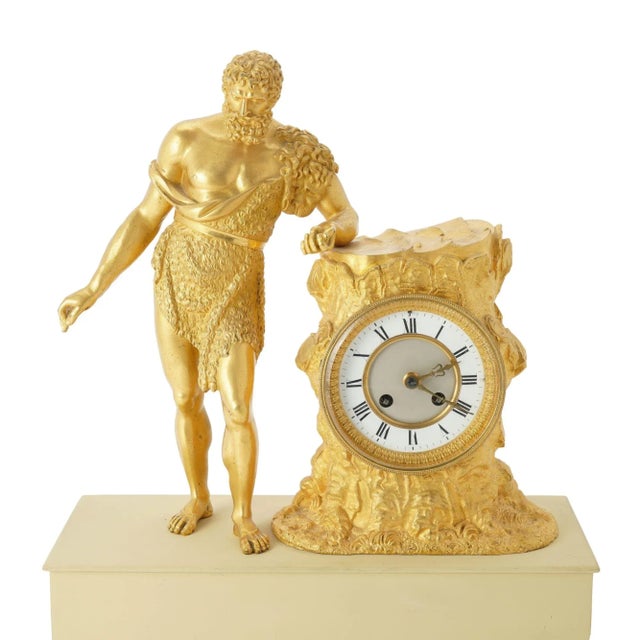 Charles X period fire gilt bronze mantel clock with a Classical figure of Paris holding an apple & leaning on a tree...