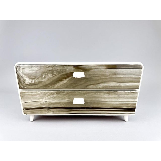 Mid-century plastic jewelry or sewing box with two drawers. The drawers have metal handles and the upper drawer is devided...