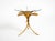 Rare 1960s gilt Florentine side table or nightstand. The frame features three curved legs topped with a thick, round glass...
