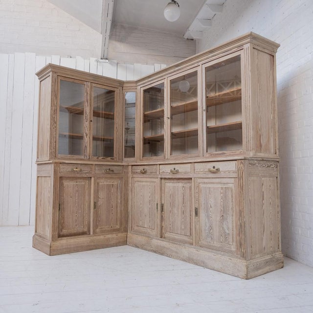 Large corner bookcase, 1930 Pitch pine furniture completely restored in our workshop. This room is made up of 5 lockable...