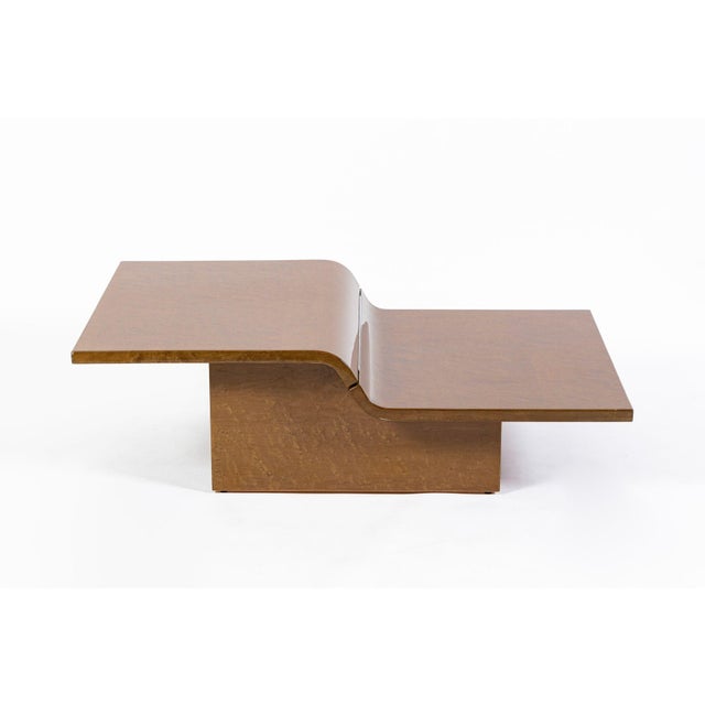 This unique vintage Italian postmodern wooden coffee table circa 1970 has fabulous modern style and a striking sculptural...