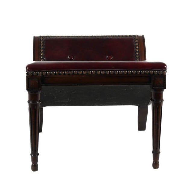A Mahogany and Naugahyde Gout Foot Stool features a sturdy mahogany frame with a comfortable seat upholstered in durable,...