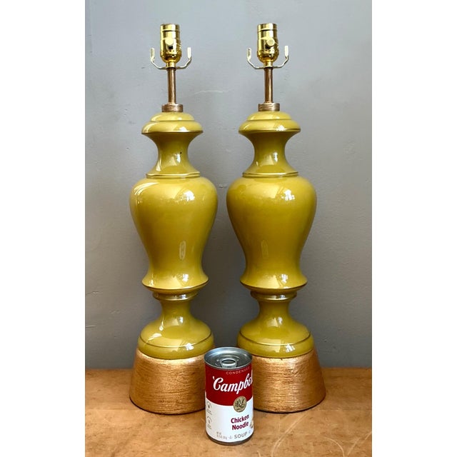 This striking pair of vintage table lamps embodies the refined elegance of Mid-Century Modern design with sculptural...