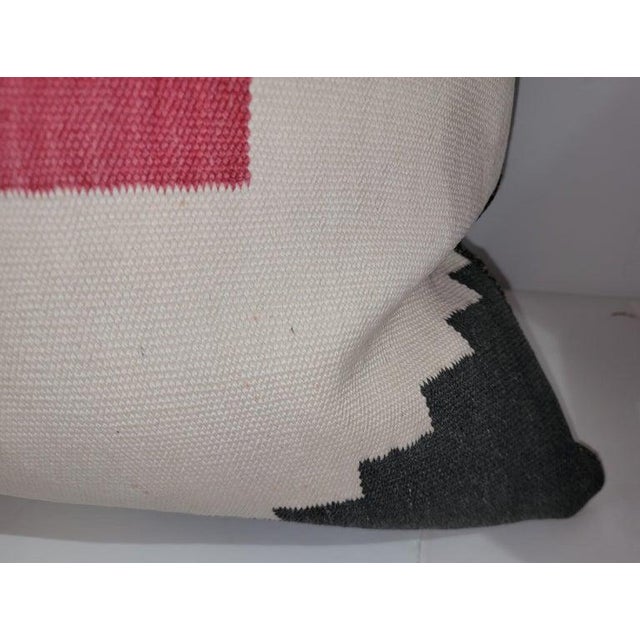 Rare wool weaving bolster pillow. Down and feather insert and zippered case. Measures: 22 x 36.