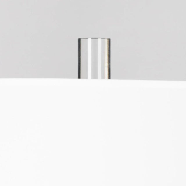 Brilliant blue instills dimensional flair in a contemporary ceramic table lamp. A vibrant statement piece on a stylish...