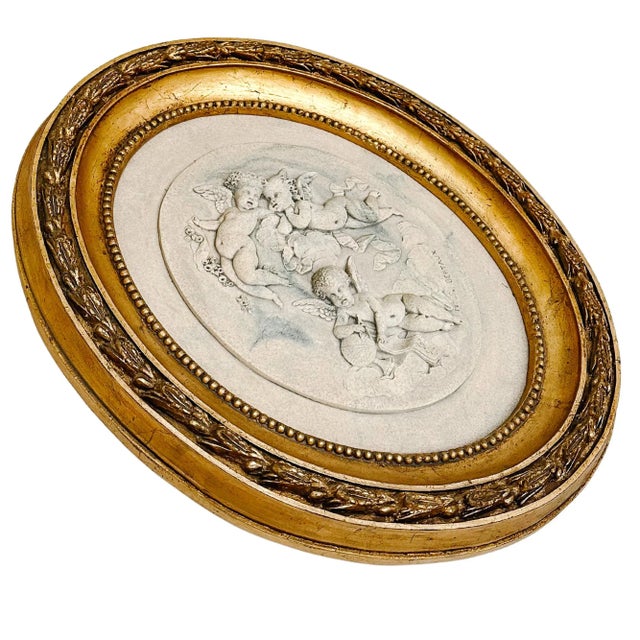 A beautiful French wall plaque vintage reproduction of Hélène Bertaux's carved marble plaque with winged cherubs in high...