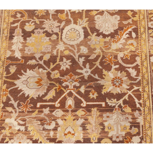 An Indian Amritsar Runner. Abstract floral and vine design on an abrashed warm brown field. The Doris Leslie Blau gallery...