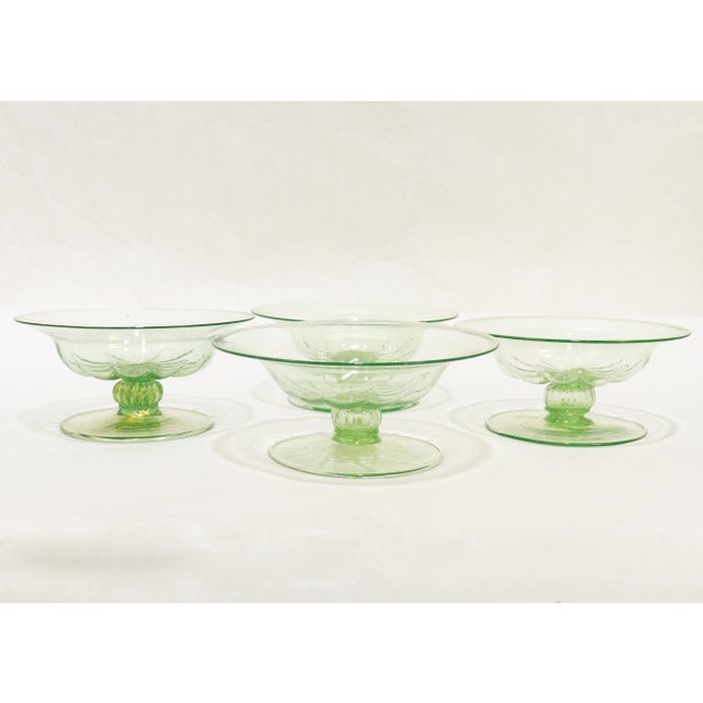 A fine, large set of Venetian glass footed tazzas or compotes for serving. Attributed to Salviati. In lime green (almost...