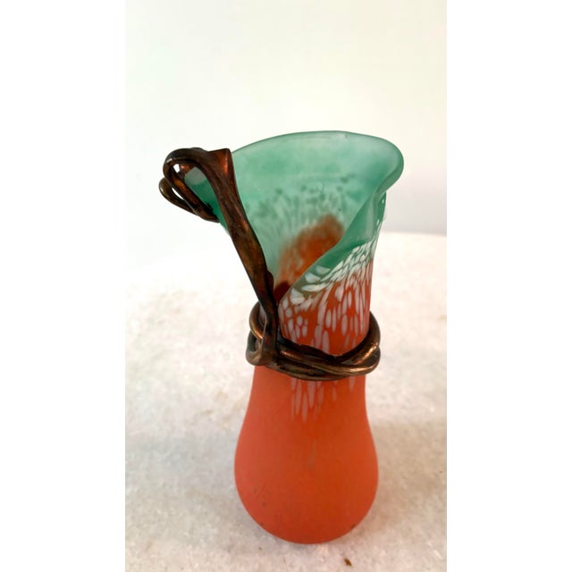 Vadan's unique mid-to-late 20th-century style, which often combines vibrant, mottled blown-glass bodies with expressive,...