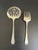 Lot of 2 serving pieces in the Hampton Court pattern by Community Plate (Oneida Silver), including a tomato server and a...