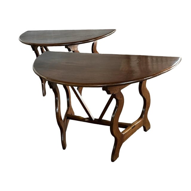 Demi-lune consoles hand-made in Italy in the late 1700s using pegged construction. The pair of tables has gorgeous lines...
