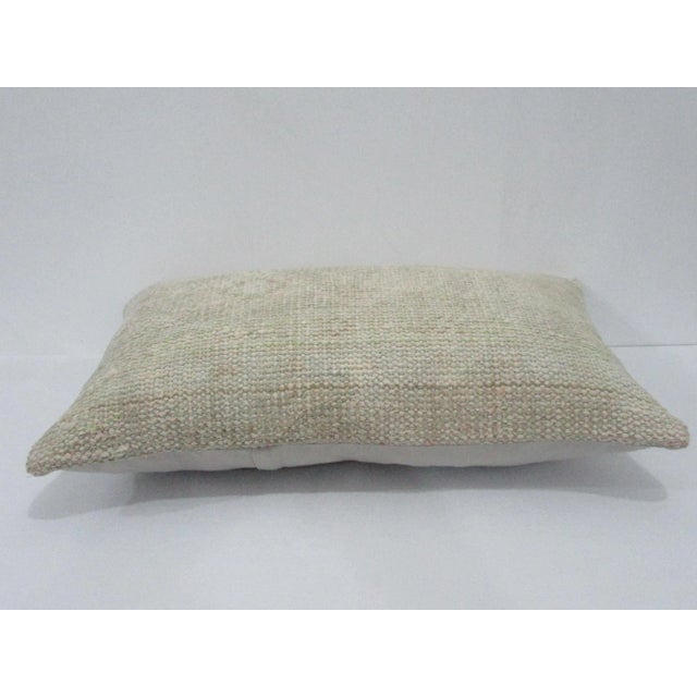 Decorative pillow cover made from a vintage Turkish handknotted rug. Backed with good quality cotton fabric. Pillow...