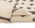 Exquisite hand-knotted wool rug with a minimalist design, featuring handwoven scattered Chocolate Brown squares across an...