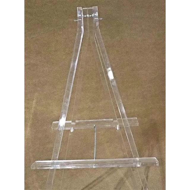 Mid-Century Modern style acrylic easel. Great for home office art display.