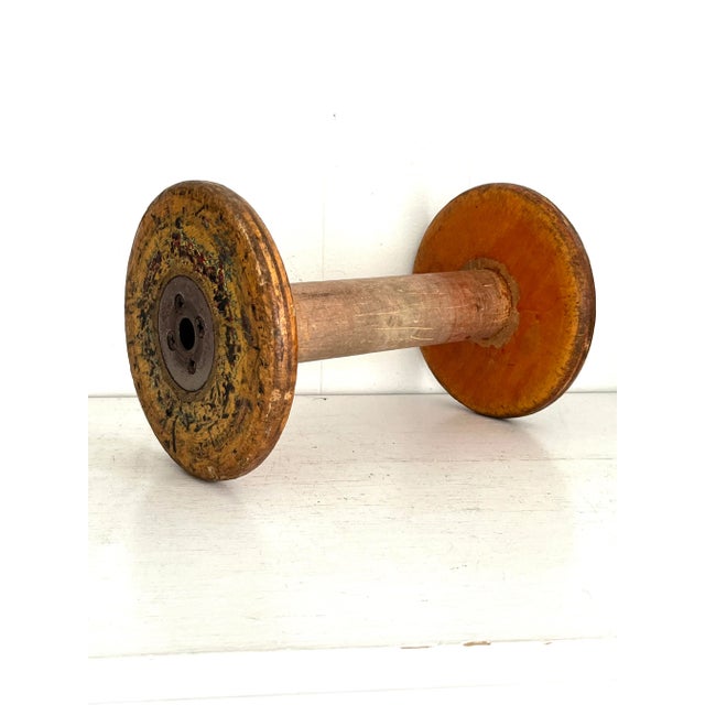 Large solid wood antique textile mill spool with a steel core. Each with a unique character due to the remaining original...
