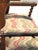 Unlike standard static furniture of the era, this chair features an early tilting mechanism secured with iron side bars...