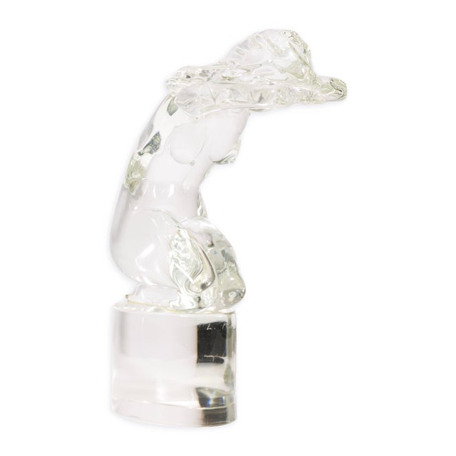 A refined clear and frosted glass sculpture by Loredano Rosin, depicting a kneeling female nude in a graceful, forward-...