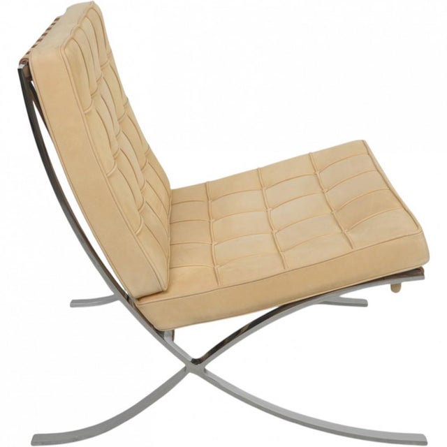Ludwig Mies van der Rohe Barcelona chair upholstered in natural colored nubuck leather and with a steel frame. The chair...